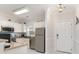Bright kitchen area with stainless steel appliances, white cabinetry and stylish countertops at 109 S Shore Blvd. # 104, Longs, SC 29568