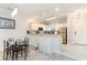 Spacious kitchen and eating area featuring sleek countertops, stainless steel appliances, and ample storage at 109 S Shore Blvd. # 104, Longs, SC 29568