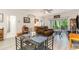 Bright living room area with a glass table set, opening to outdoor patio and well-lit seating area at 109 S Shore Blvd. # 104, Longs, SC 29568