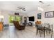 Living and dining area with modern lighting, ceiling fan, and access to patio with outdoor views at 109 S Shore Blvd. # 104, Longs, SC 29568