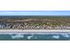 Aerial view of beachfront homes and ocean waves at 112 Cockle Shell Ct., Pawleys Island, SC 29585