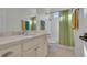 Clean bathroom with a single vanity and green shower curtain at 112 Cockle Shell Ct., Pawleys Island, SC 29585