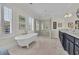 Elegant bathroom with soaking tub, shower, and dark vanity at 112 Cockle Shell Ct., Pawleys Island, SC 29585