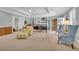 Spacious bedroom with carpeting, seating area, and large bed at 112 Cockle Shell Ct., Pawleys Island, SC 29585