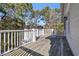 Spacious deck with wooden flooring and white railings at 112 Cockle Shell Ct., Pawleys Island, SC 29585