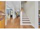 Bright and spacious entryway with hardwood floors and staircase at 112 Cockle Shell Ct., Pawleys Island, SC 29585