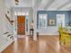 Hardwood floors, staircase, and view into the dining room at 112 Cockle Shell Ct., Pawleys Island, SC 29585