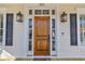 Elegant wooden front door with sidelights and decorative transom window at 112 Cockle Shell Ct., Pawleys Island, SC 29585
