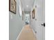 Bright hallway with light walls and neutral carpeting at 112 Cockle Shell Ct., Pawleys Island, SC 29585