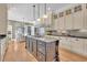 Spacious kitchen featuring granite countertops, an island, and ample cabinetry at 112 Cockle Shell Ct., Pawleys Island, SC 29585