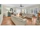 Spacious living room with hardwood floors, comfortable sofas, and access to the outdoors at 112 Cockle Shell Ct., Pawleys Island, SC 29585