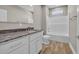 Bathroom with granite countertops, single sink, and bathtub with shower at 1151 Bear Lake Dr., Longs, SC 29568