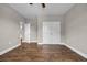 An empty bedroom features luxury vinyl plank flooring and a double door closet for ample storage at 1151 Bear Lake Dr., Longs, SC 29568