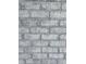 Close up view of a gray painted brick wall, demonstrating material and design at 1151 Bear Lake Dr., Longs, SC 29568