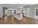Modern kitchen with island, pendant lighting, and stainless steel appliances at 1151 Bear Lake Dr., Longs, SC 29568