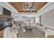 Open-concept living room with fireplace, wood ceiling, and views of kitchen at 1151 Bear Lake Dr., Longs, SC 29568