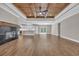 Bright, open living space featuring a fireplace, wood ceiling, and views of backyard at 1151 Bear Lake Dr., Longs, SC 29568