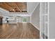 Spacious living area with hardwood floors, seamlessly connecting to the modern kitchen at 1151 Bear Lake Dr., Longs, SC 29568