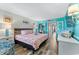A brightly decorated bedroom with a cozy bed, seaside decor, and ample natural light at 2311 S Ocean Blvd. # 1125, Myrtle Beach, SC 29577