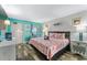 A charming bedroom featuring wood-look floors, a comfy bed, and beach-themed accents at 2311 S Ocean Blvd. # 1125, Myrtle Beach, SC 29577