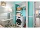 A convenient laundry closet featuring a washer and storage shelves at 2311 S Ocean Blvd. # 1125, Myrtle Beach, SC 29577
