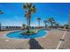 Attractive pool area with lush landscaping and a shallow pool at 2311 S Ocean Blvd. # 1125, Myrtle Beach, SC 29577