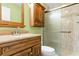 Bathroom with wood vanity, shower, and a large mirror at 305 21St Ave. S # 108, Myrtle Beach, SC 29577