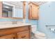 Clean bathroom, featuring a wood vanity and light blue walls at 305 21St Ave. S # 108, Myrtle Beach, SC 29577