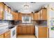 Galley kitchen with oak cabinets and window at 305 21St Ave. S # 108, Myrtle Beach, SC 29577