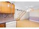 Kitchen with oak cabinets, dishwasher, and view of staircase at 305 21St Ave. S # 108, Myrtle Beach, SC 29577
