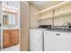 Laundry closet with a washer and dryer and shelving at 305 21St Ave. S # 108, Myrtle Beach, SC 29577