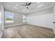 Bright bedroom features tray ceilings, recessed lighting, wood-look floors and paneled accent wall at 3368 Gurley Rd., Loris, SC 29569