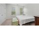 Well-lit bedroom with a queen bed and large windows at 413 Oxner Ct., Myrtle Beach, SC 29579