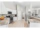 Modern kitchen with white cabinets, stainless steel appliances, and granite countertops at 413 Oxner Ct., Myrtle Beach, SC 29579