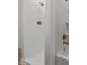 Elegant bathroom showcasing a white shower with modern gold fixtures and bright natural lighting at 447 Bragdon Ave., Georgetown, SC 29440