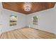 Well-lit bedroom featuring hardwood floors, two windows for natural light, and neutral paint at 447 Bragdon Ave., Georgetown, SC 29440