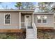 Charming home featuring a brick foundation, light gray siding, and freshly painted white trim at 447 Bragdon Ave., Georgetown, SC 29440