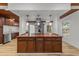 Kitchen island with a wood countertop, stainless steel range hood, and modern pendant lighting at 447 Bragdon Ave., Georgetown, SC 29440