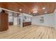 Spacious kitchen with new wood-look floors, white walls, and modern stainless steel appliances at 447 Bragdon Ave., Georgetown, SC 29440