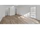 Bright, airy living room with hardwood floors and a glass paneled patio door to the outside at 447 Bragdon Ave., Georgetown, SC 29440