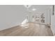 Bright living room featuring hardwood floors, white walls, and access to the back patio at 447 Bragdon Ave., Georgetown, SC 29440