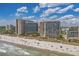 Coastal aerial view of two high-rise buildings featuring beach access and scenic ocean views at 4800 S Ocean Blvd. # 1219, North Myrtle Beach, SC 29582