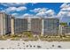 Aerial view of the Beach Cove Resort, showcasing its beachfront location and multiple pools at 4800 S Ocean Blvd. # 1219, North Myrtle Beach, SC 29582