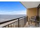 Enjoy ocean views from this condo balcony, complete with comfortable seating and a relaxing atmosphere at 4800 S Ocean Blvd. # 1219, North Myrtle Beach, SC 29582