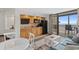 Inviting living area with open kitchen, balcony access, and ocean view at 4800 S Ocean Blvd. # 1219, North Myrtle Beach, SC 29582