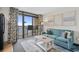 Bright and airy living room with an ocean view balcony, creating a serene atmosphere with lots of natural light at 4800 S Ocean Blvd. # 1219, North Myrtle Beach, SC 29582