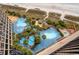 Overhead shot of the complex's multiple pools and recreation zones, with lush tropical plants at 4800 S Ocean Blvd. # 1219, North Myrtle Beach, SC 29582