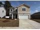 Two-story home with a two-car garage, manicured lawn and neutral color scheme at 528 Tillage Ct., Conway, SC 29526