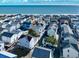 Serene coastal community featuring charming beach homes and ocean views in the distance at 6001 - 1045 S Kings Hwy., Myrtle Beach, SC 29575