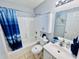 This bathroom is equipped with a shower-tub combo, toilet and single vanity with white cabinets at 6001 - 1045 S Kings Hwy., Myrtle Beach, SC 29575